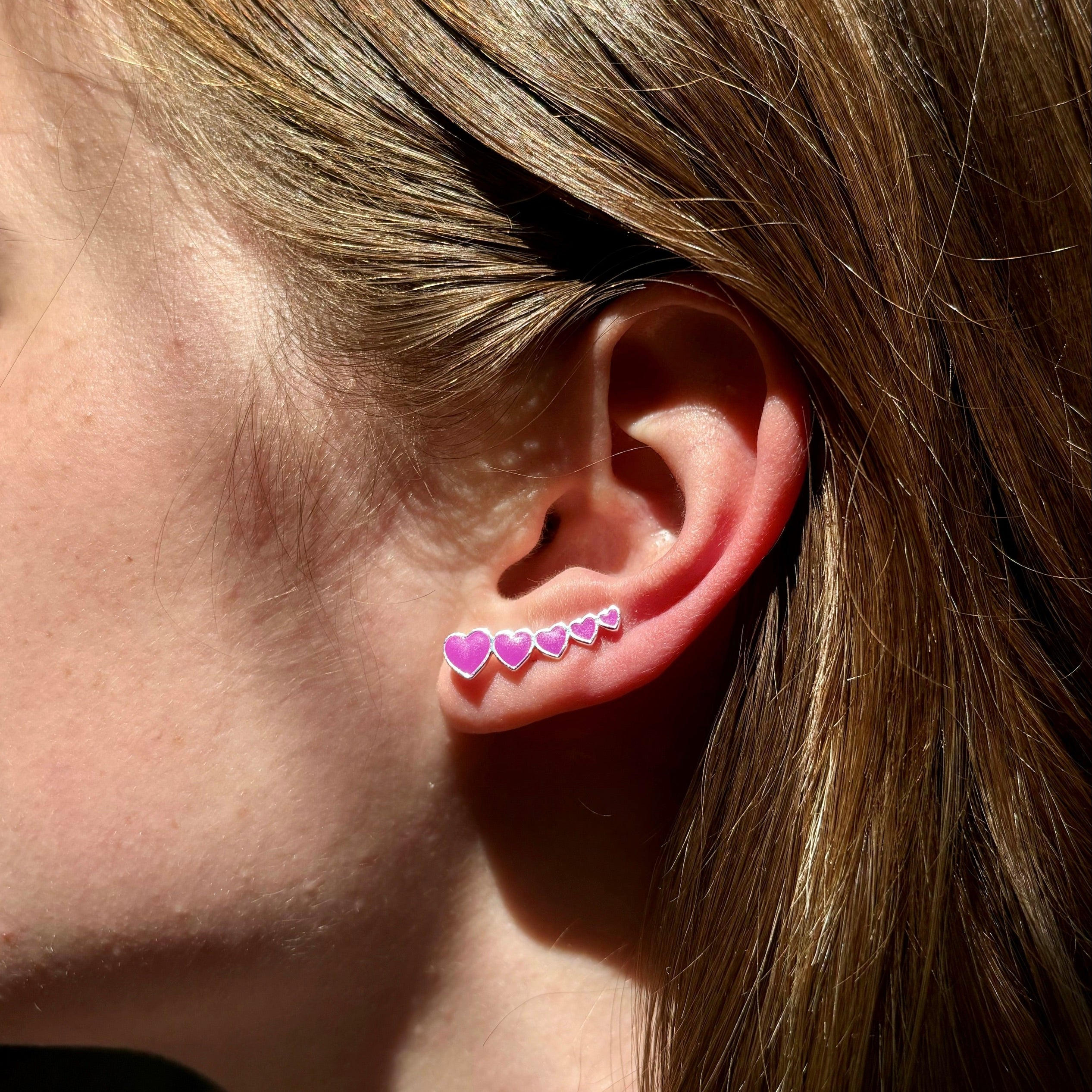 heart climber earrings_pink and silver_on ear