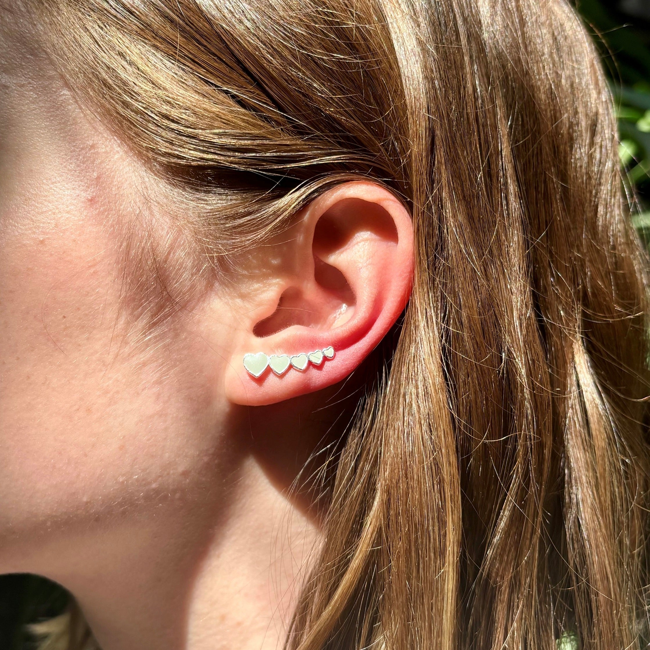 heart climber earrings_white and silver_on ear