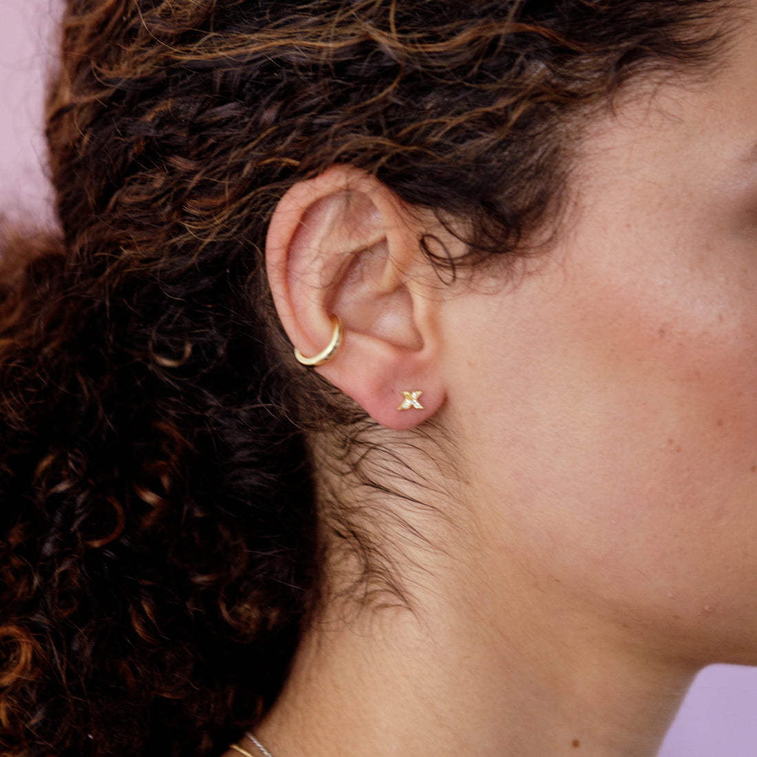 kiss-shine-studs-gold-stacking-on-ear-view