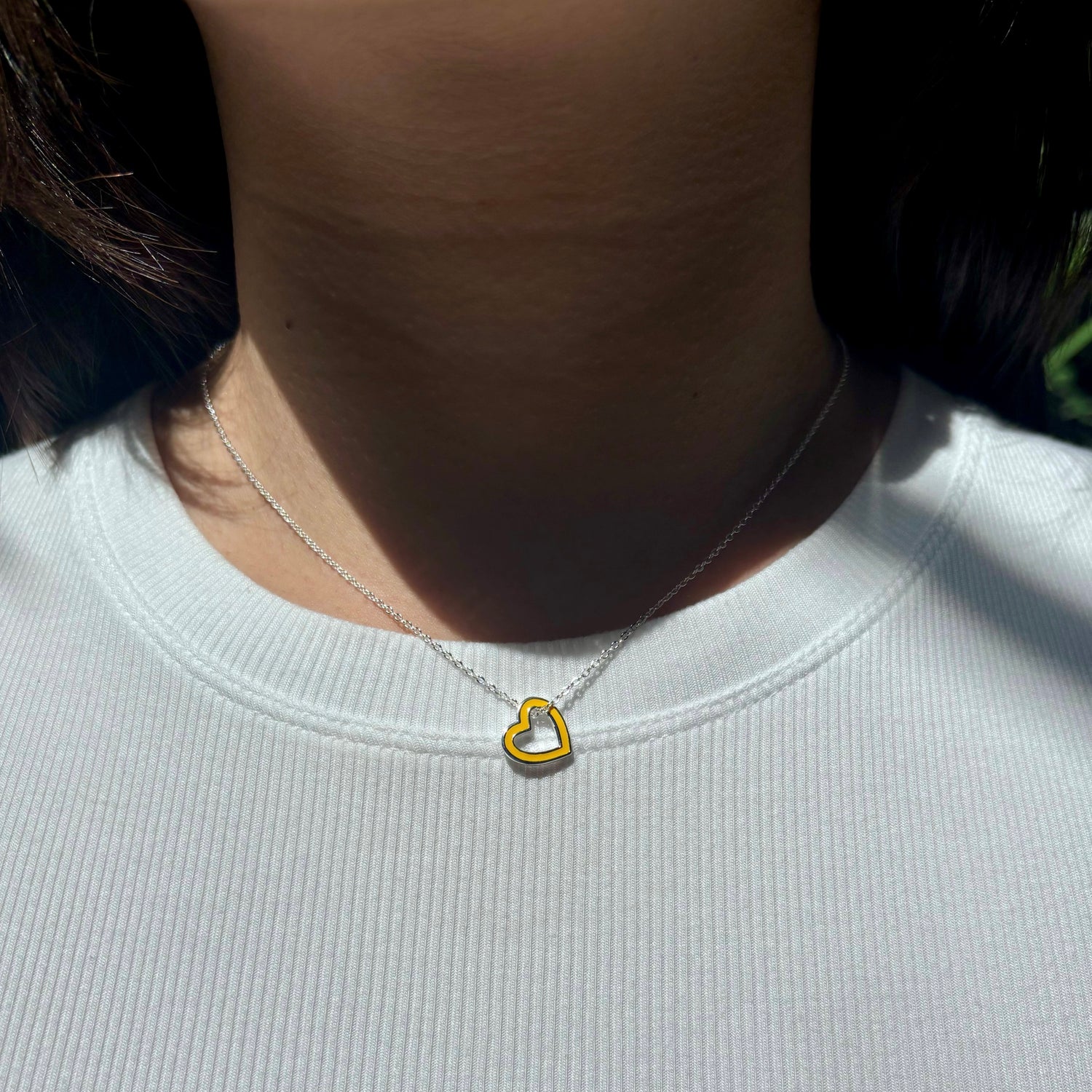 open-heart-necklace-yellow-silver-on-neck-view
