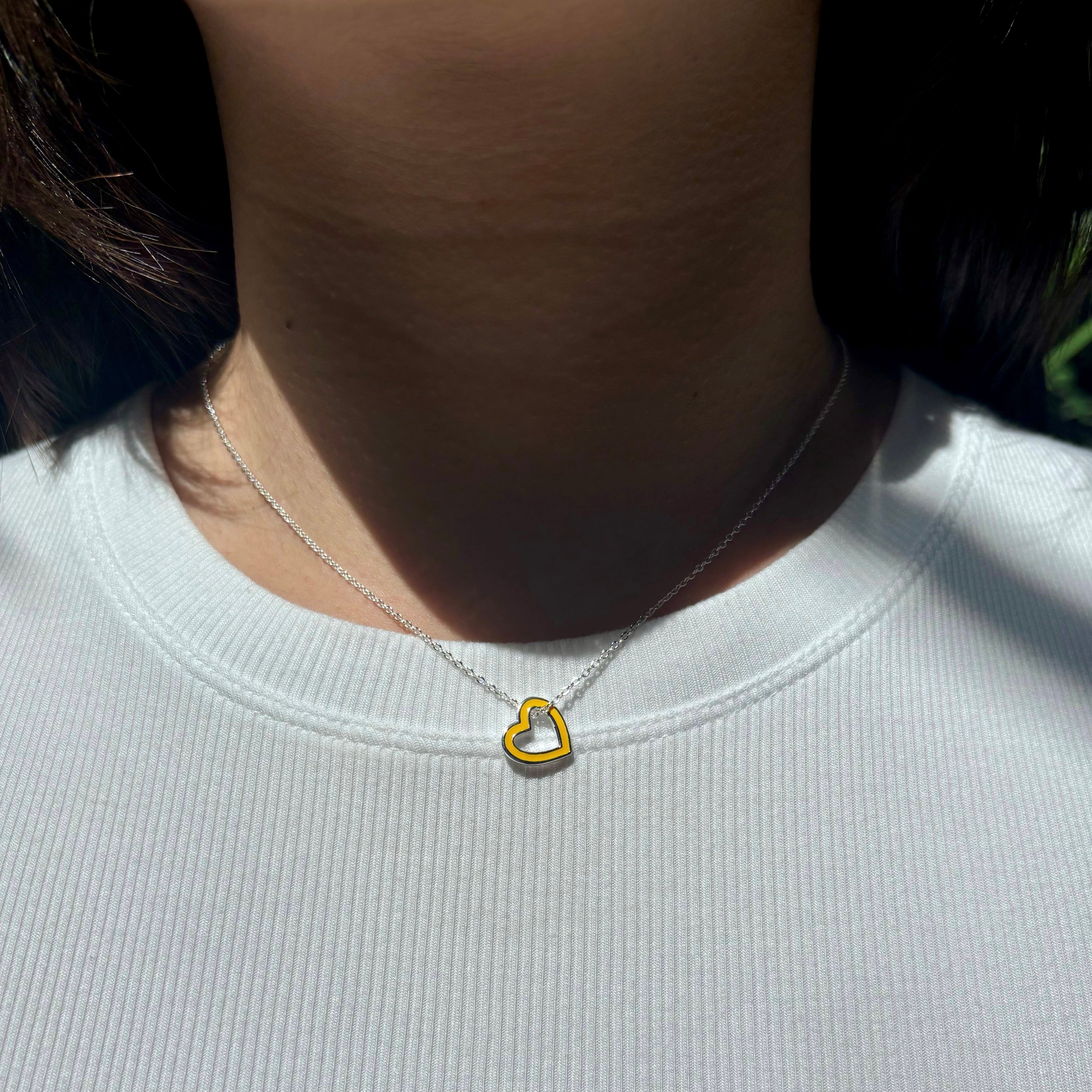 open-heart-necklace-yellow-silver-on-neck-view