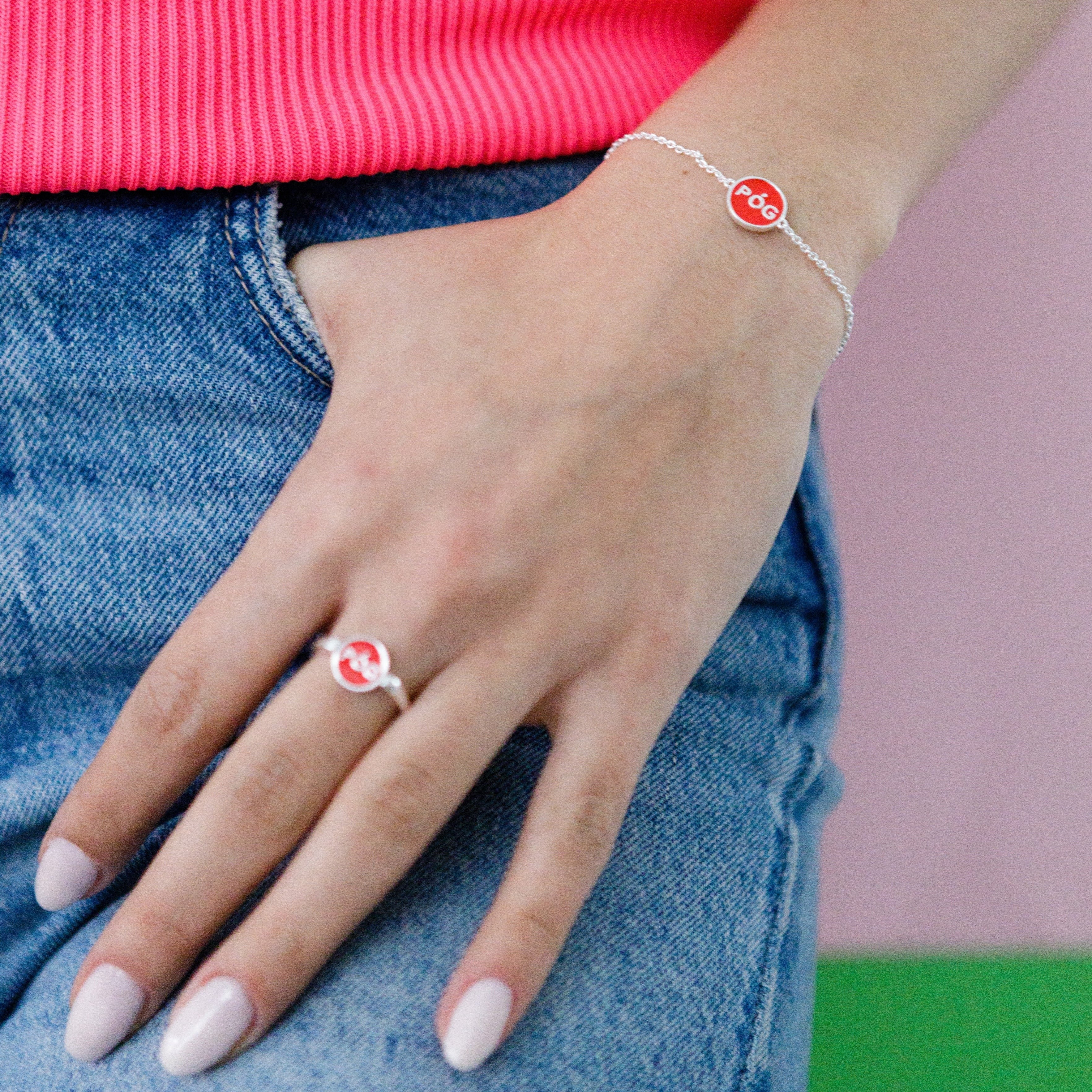 charm-bracelet-stacking-red-silver-on-hand-view