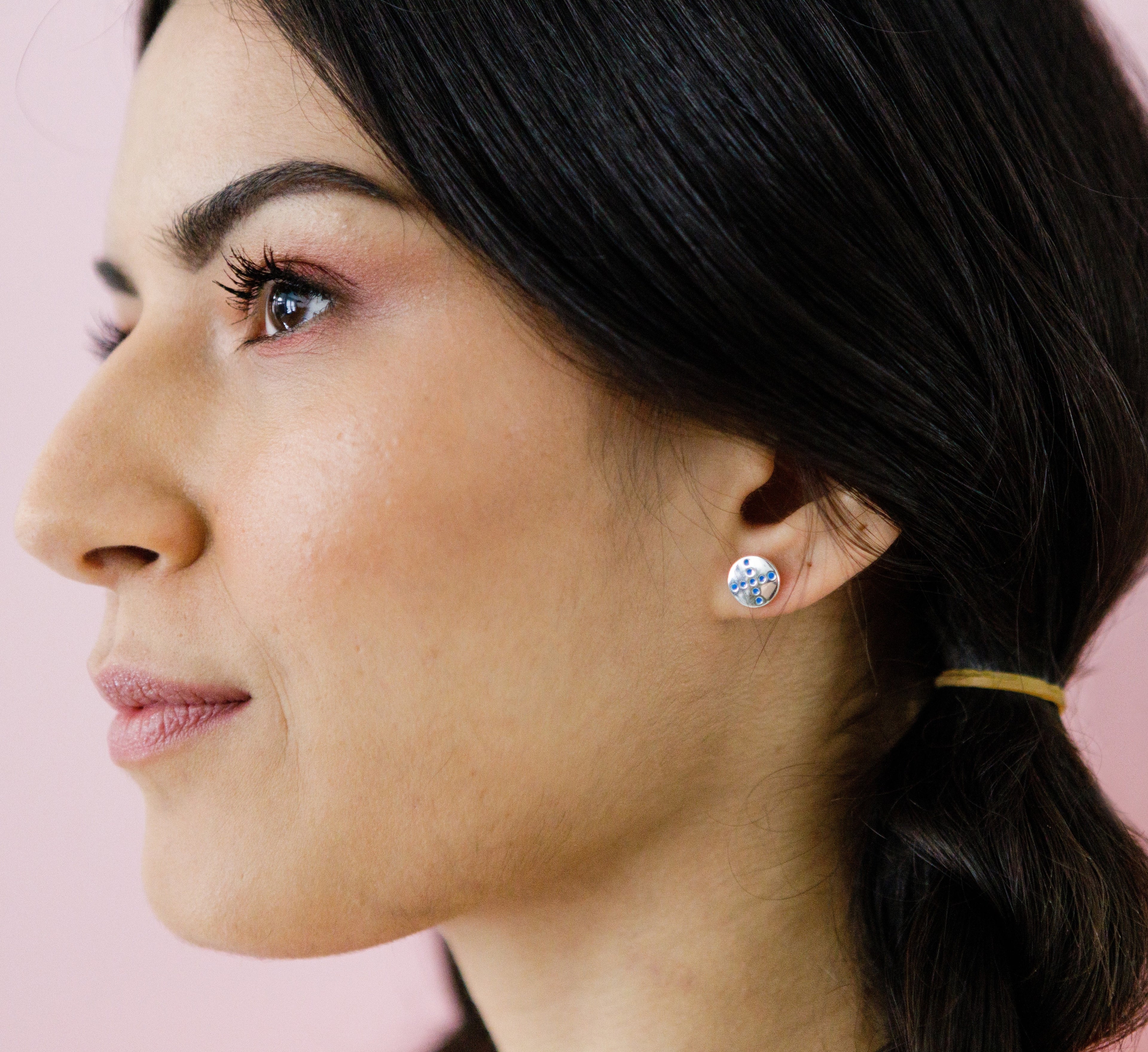 pog-studs-blue-silver-spin-on-ear-view