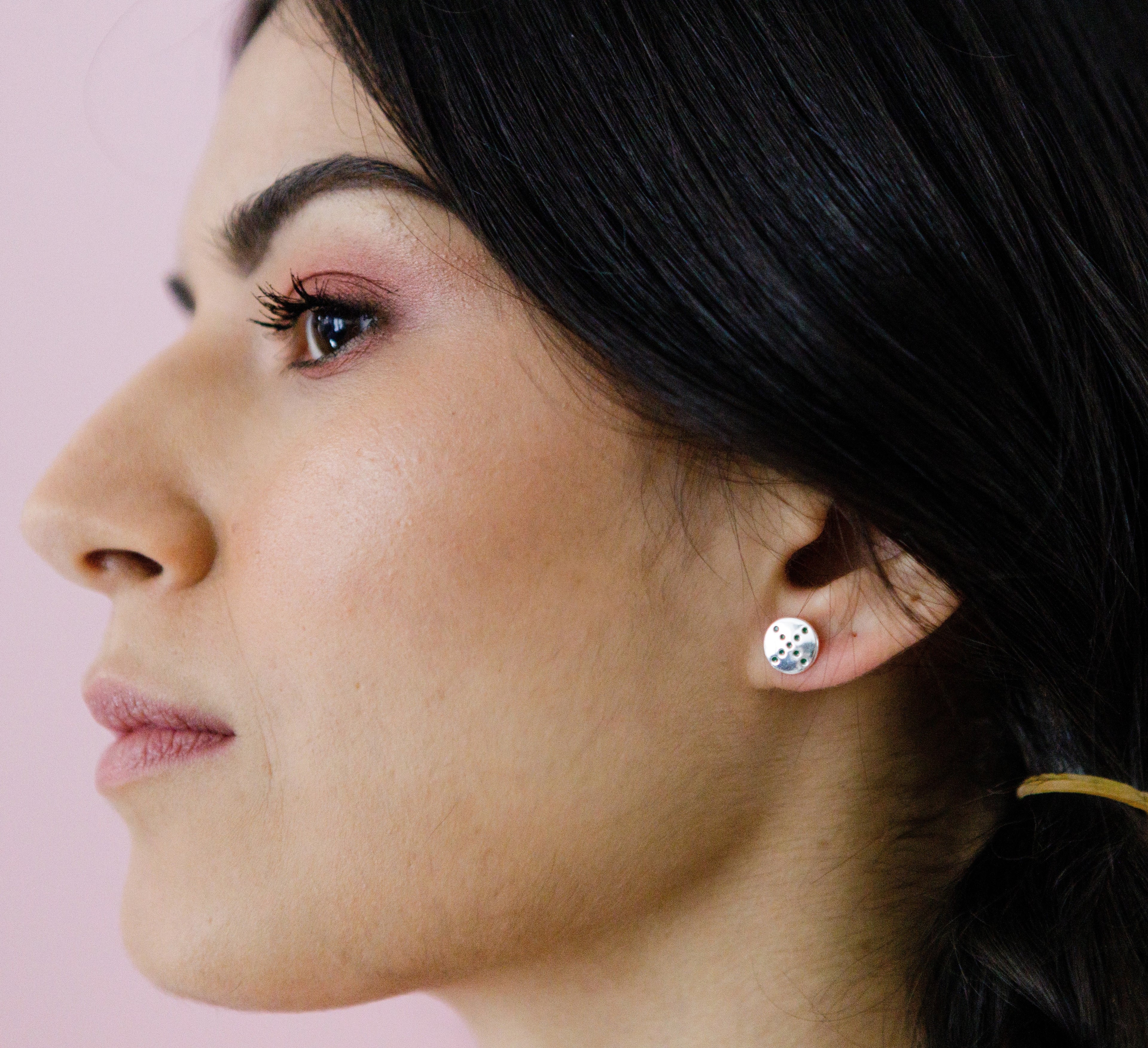 pog-studs-spin-green-silver-on-ear-view