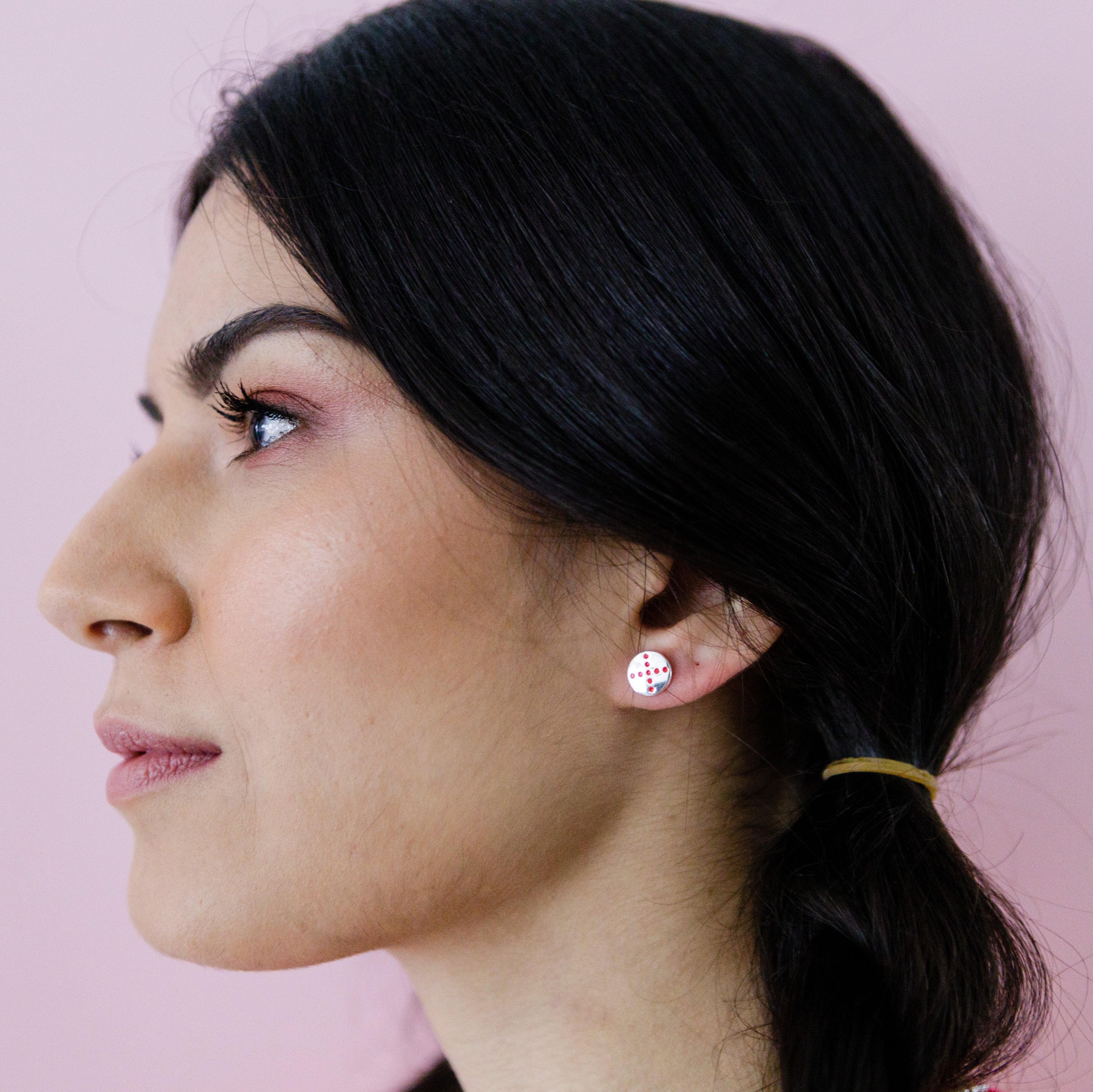 pog-studs-red-spin-silver-on-ear-view