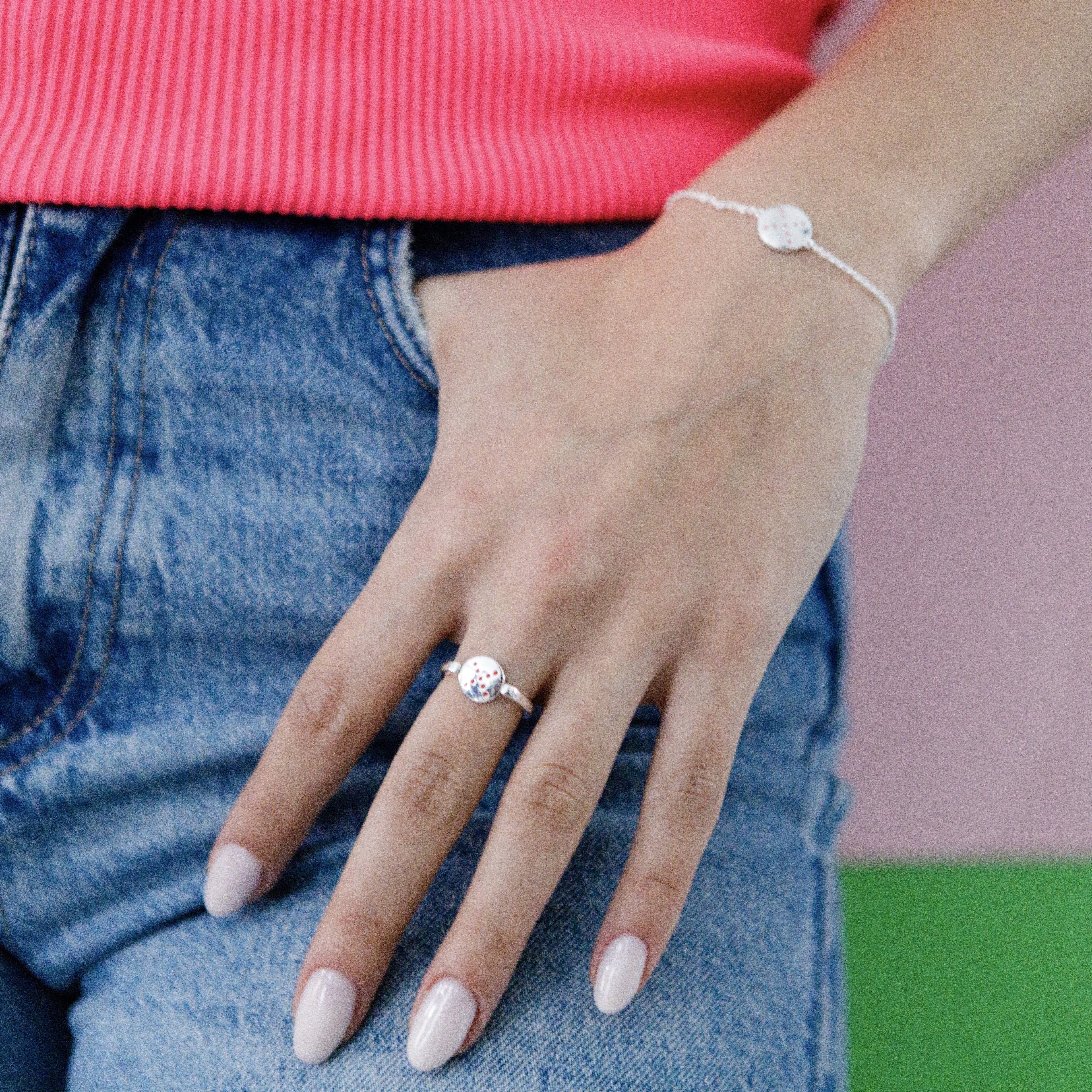 spinning-ring-red-bracelet-red-stacking-on-hand-view