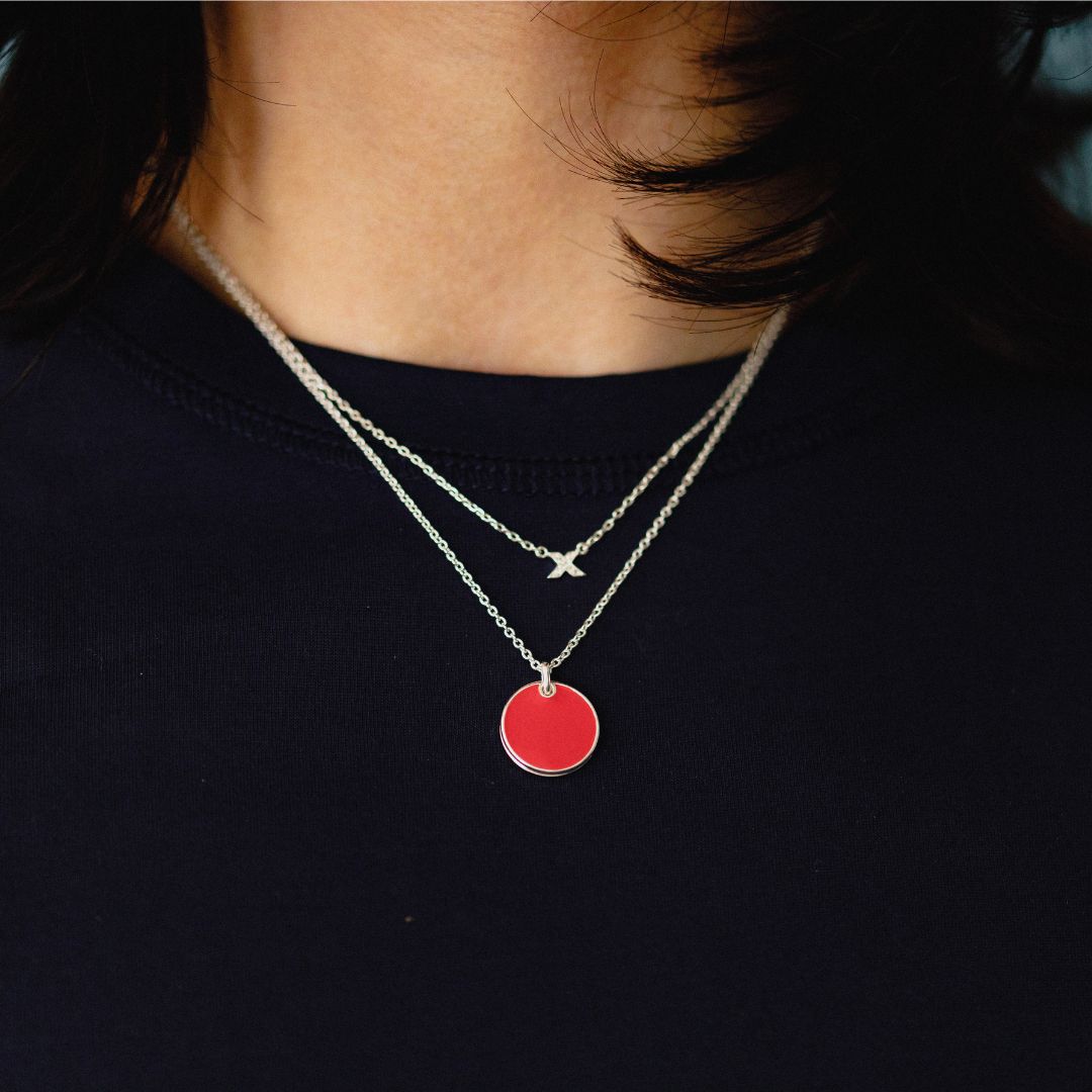 fidget locket_with hidden kiss_red silver_on neck
