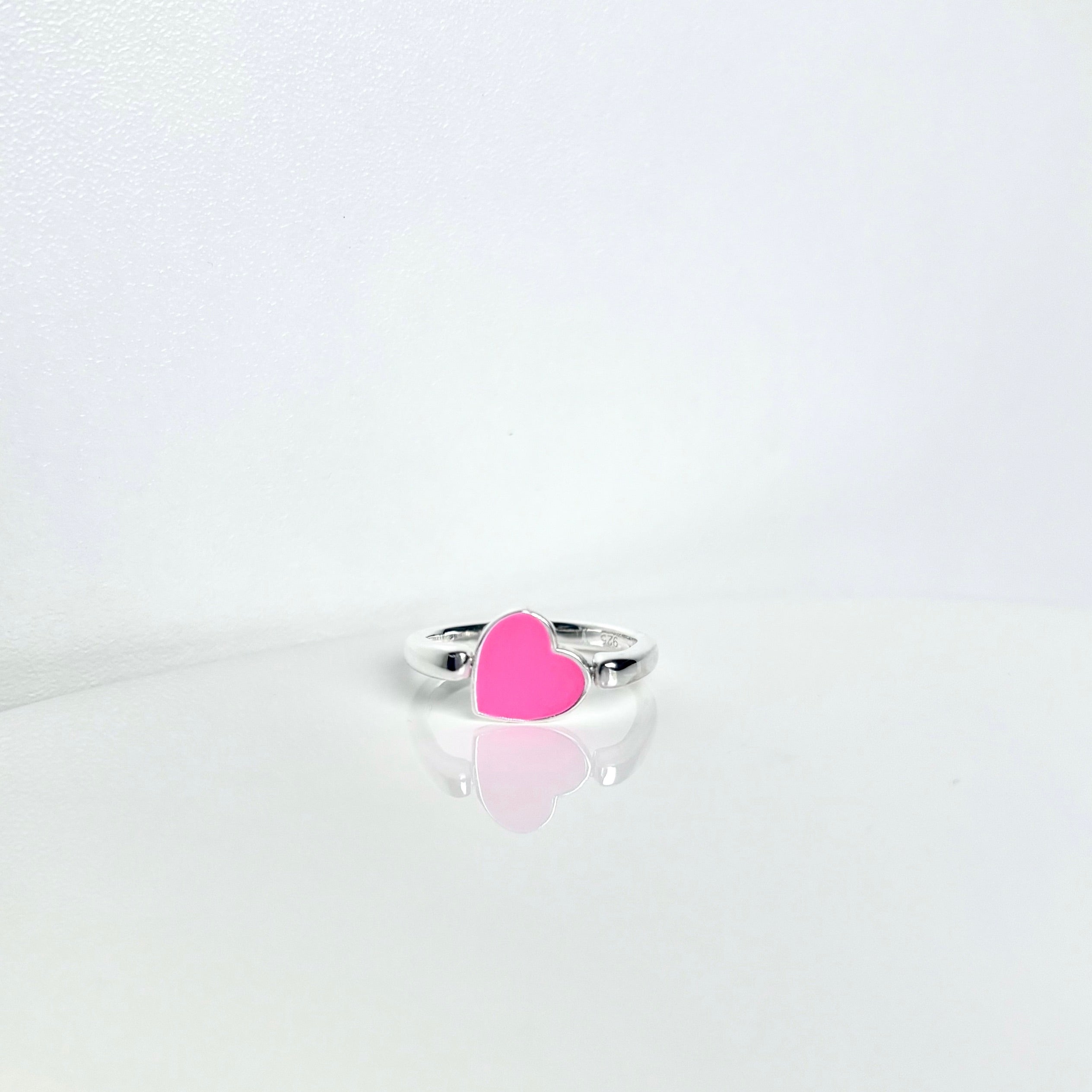 póg jewellery_silver fidget ring with pink heart_front view