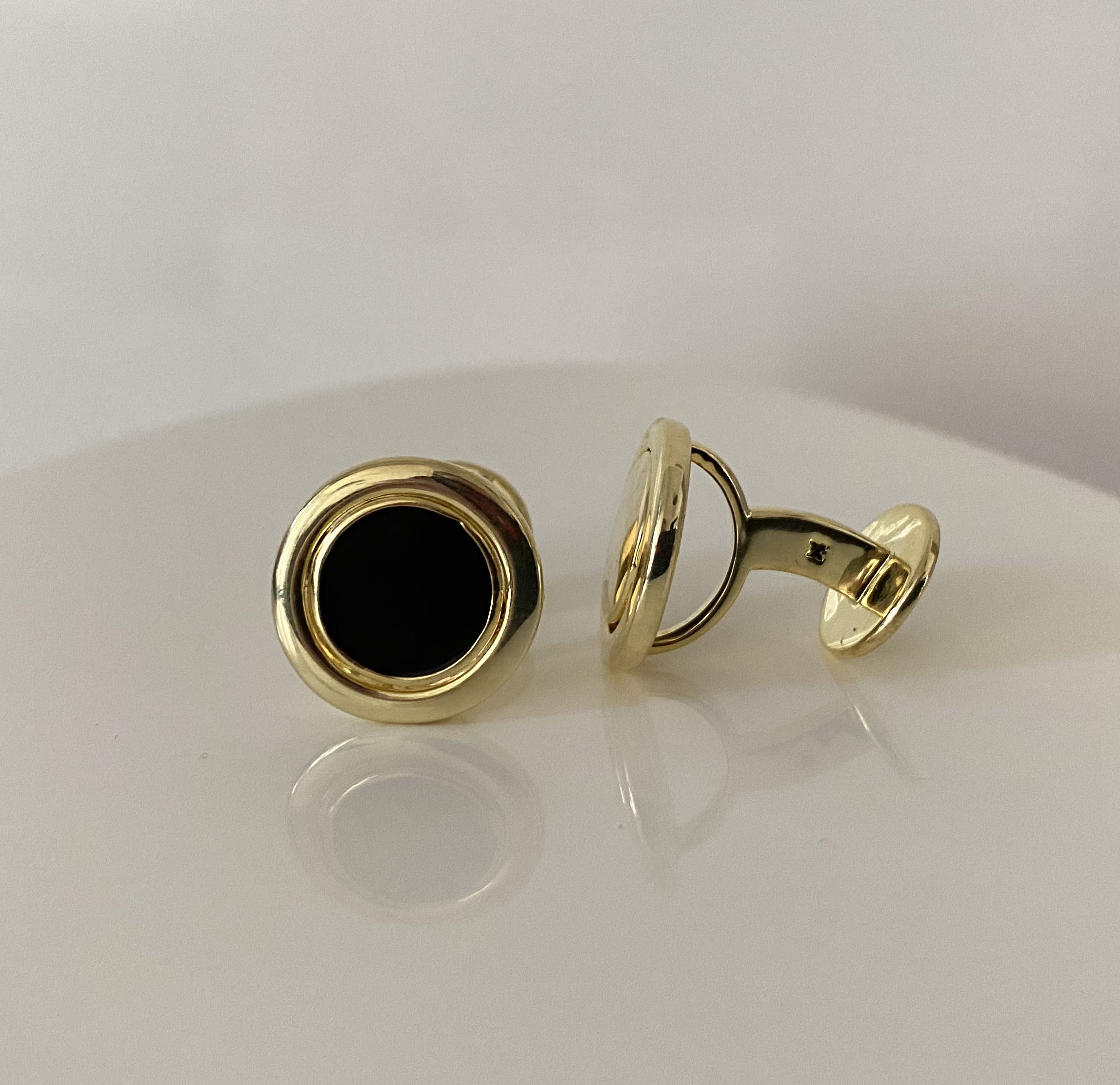 Gemelos giratorios de oro