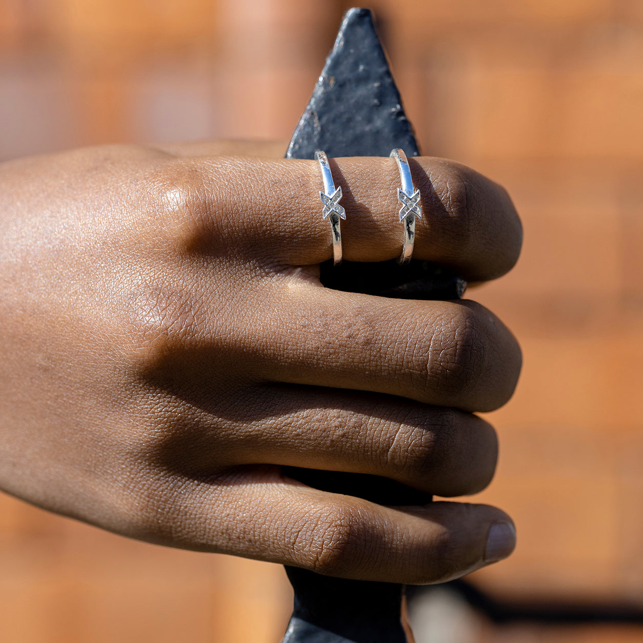 shine-kiss-rings-silver-gold-stacking-on-hand-view