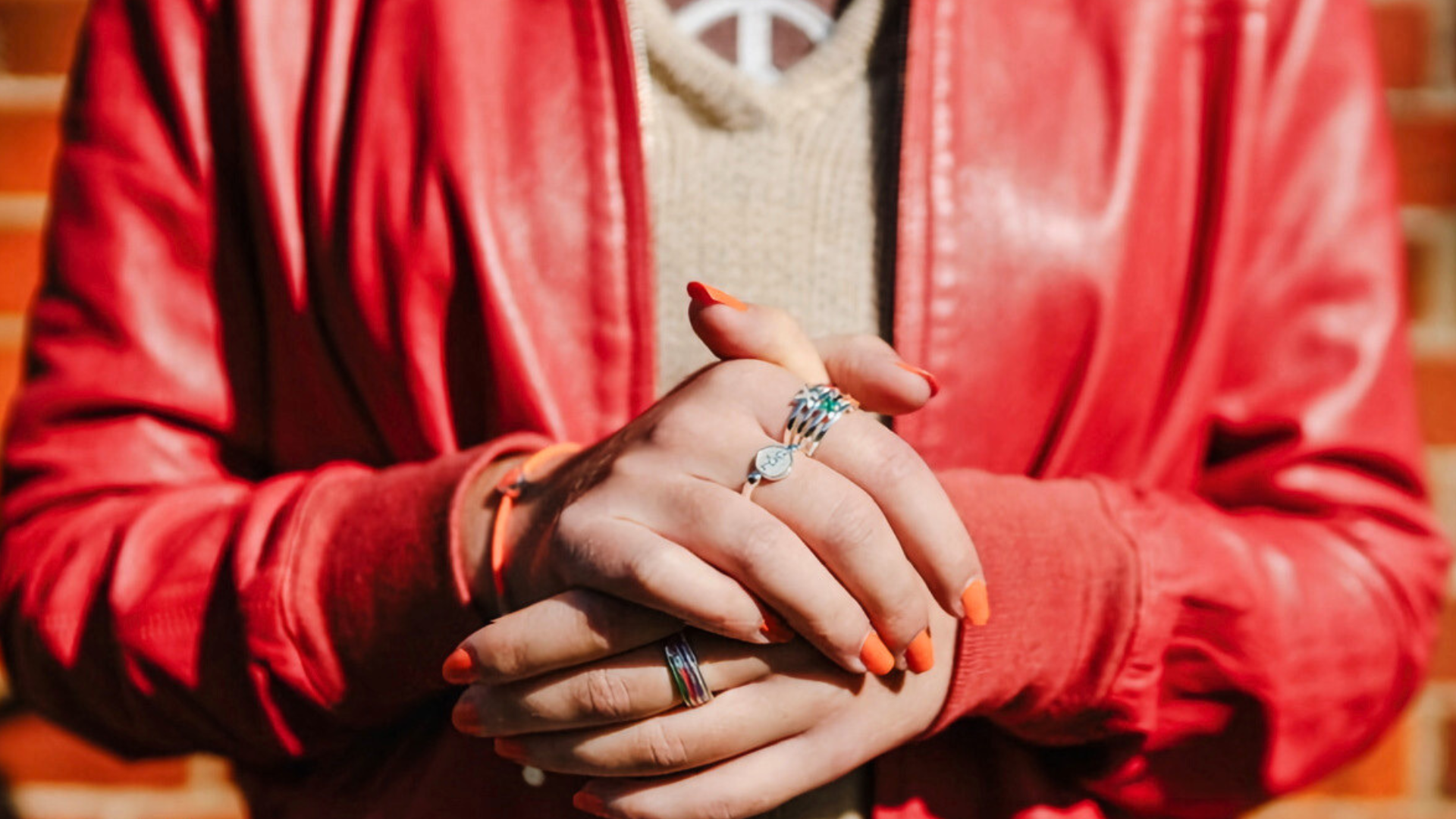 Orange nails and red jacket