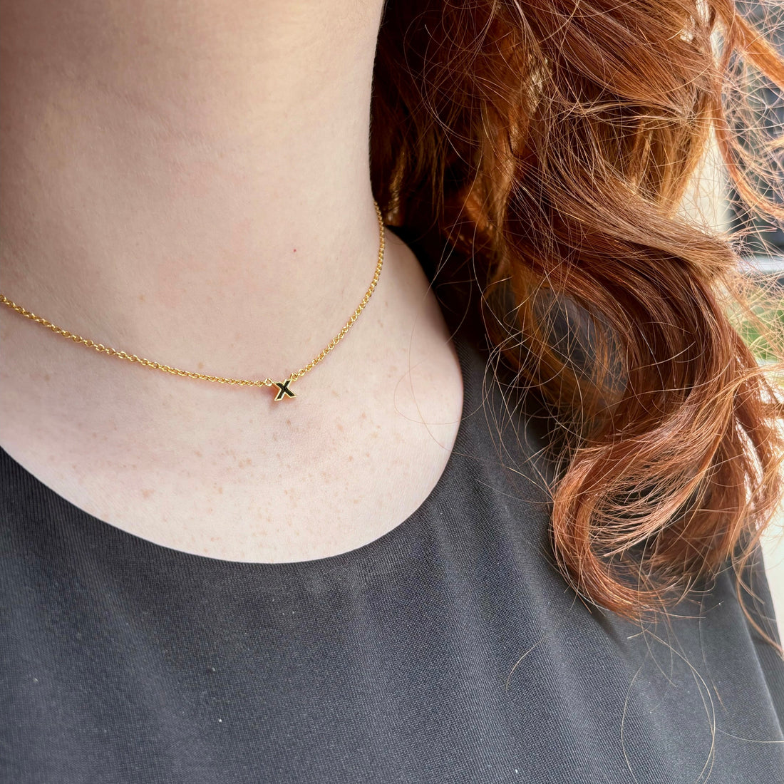 kiss-pendant-necklace-black-on-neck-view