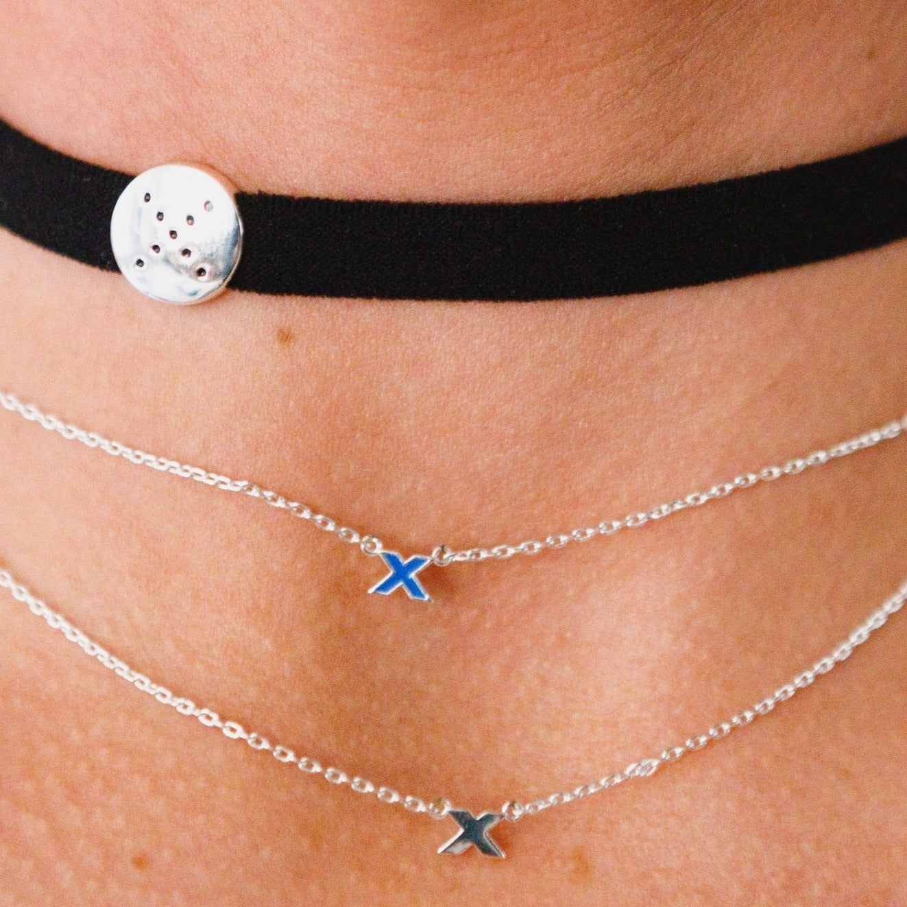 pog-choker-kiss-pendant-necklace-stacking-black-blue-on-neck-view